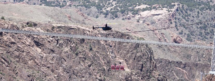 Overhead perspective of helicopter flying above Royal Gorge with the Arkansas River 1,200 feet below