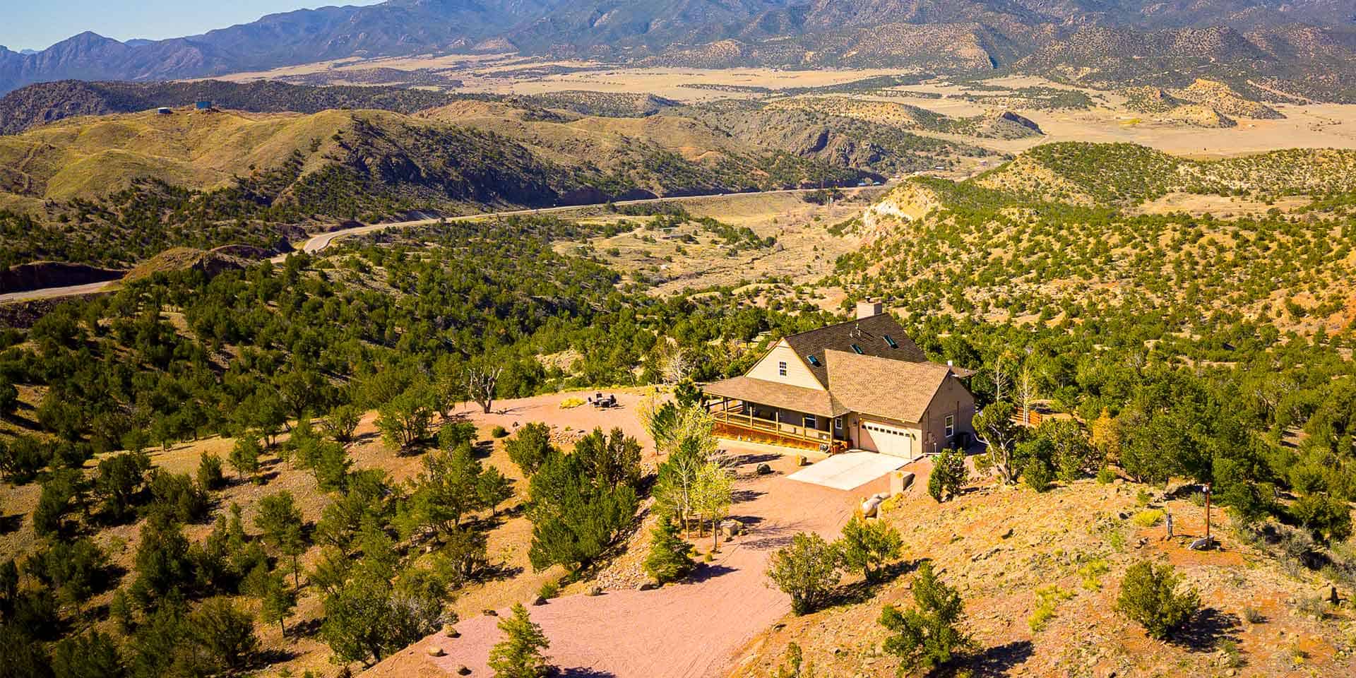 Luxury vacation rental property overlooking the Arkansas River with mountain views, hot tub, and outdoor deck in Canon City Colorado