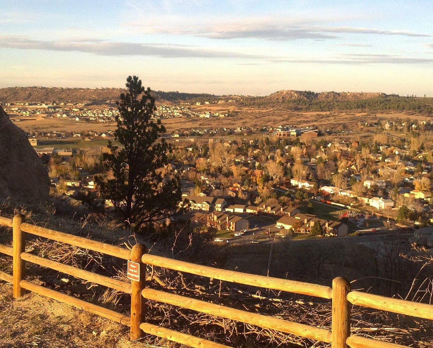 Castle Rock butte landmark with downtown shops and restaurants below, Colorado Front Range tourism destination