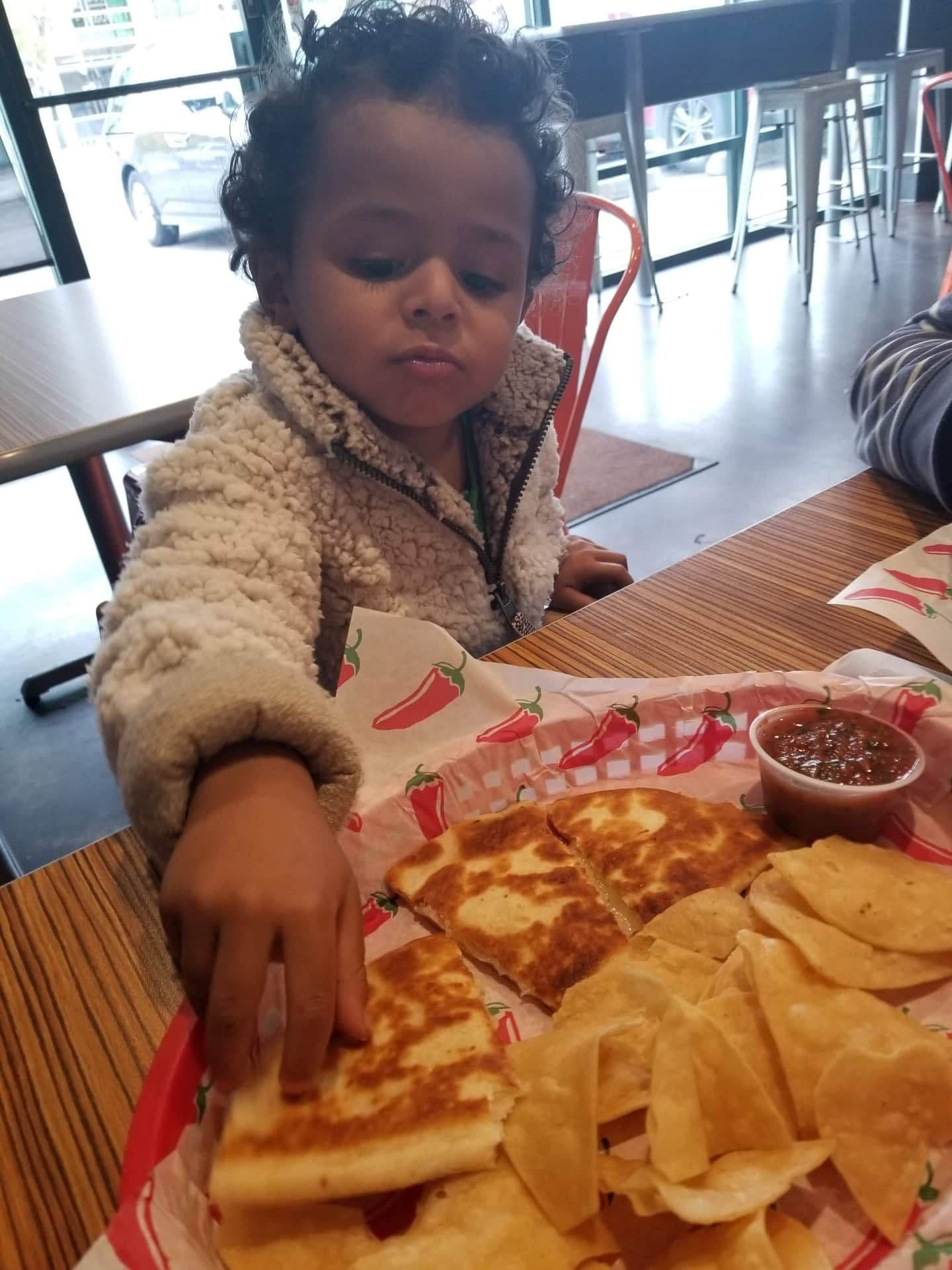 Authentic enchiladas with red chile sauce, melted cheese, and fresh garnish at Yolanda's Tacos y Mas — Castle Rock Mexican restaurant since 1971